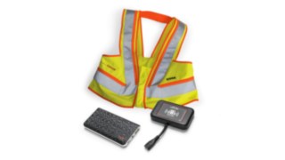 Giubbotto segnaletico interattivo, unità portatile e unità sul carrello elevatore
