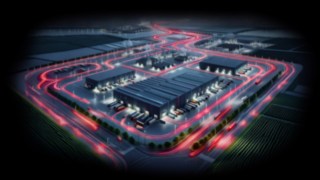 Le soluzioni Linde contribuiscono a garantire il flusso di produzione nell'industria automobilistica. Magazzino dall'alto di notte